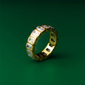 Luna eternity gold ring with embedded gemstones on a green background