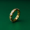 Romantic heart Gold ring with embedded diamonds on a green background